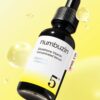 numbuzin No.5+ Glutathione Vitamin Concentrated Serum 30 ml bottle on yellow background