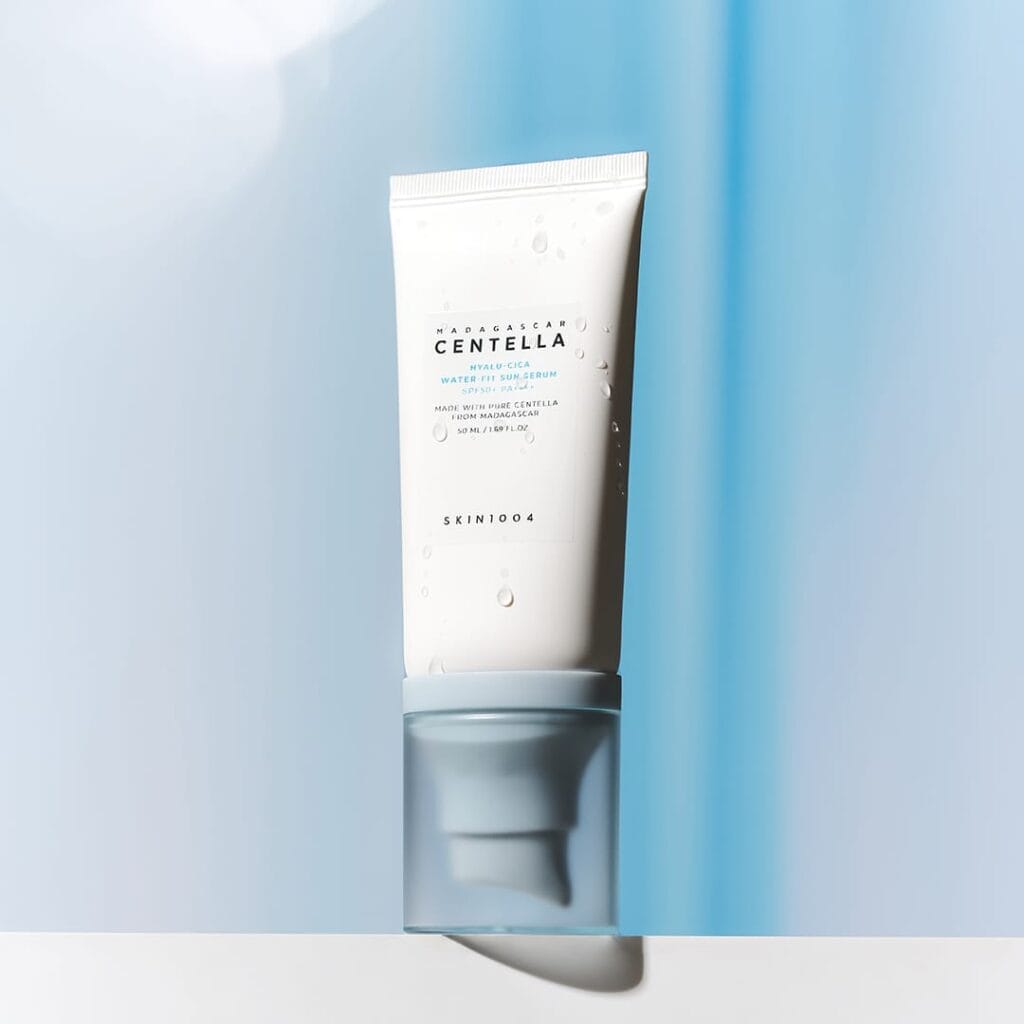 SKIN1004 Hyalu-Cica Water-Fit Sun Serum SPF50+ PA++++ 50 ml tube on a blue background