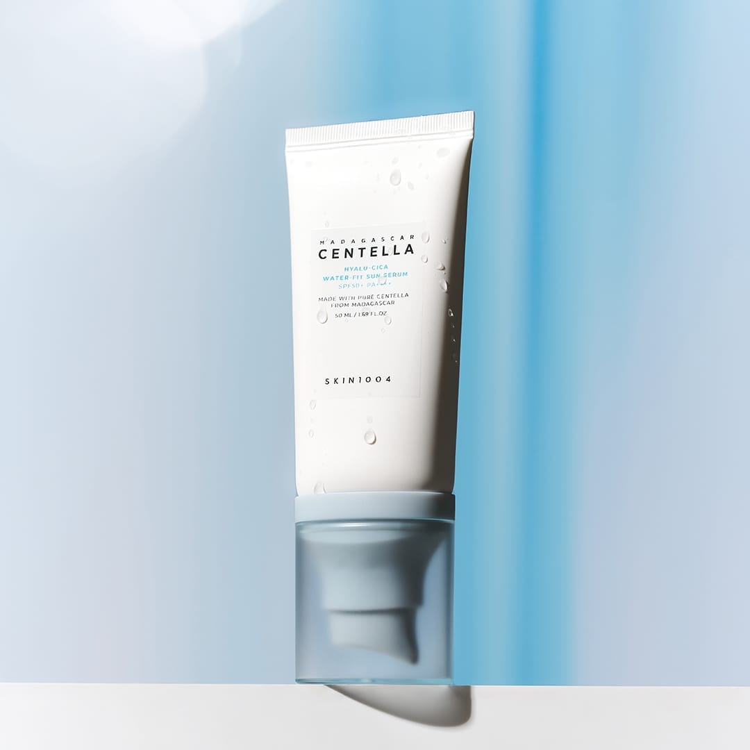 SKIN1004 Hyalu-Cica Water-fit Sun Serum SPF50+ PA++++ - Simpli Cosmetics Kenya SKIN1004 Hyalu-Cica Water-Fit Sun Serum SPF50+ PA++++ 50 ml tube on a blue background