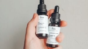 Two skincare serum bottles being compared side by side